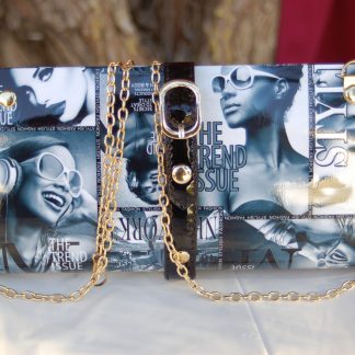 Magazine style hard case clutch