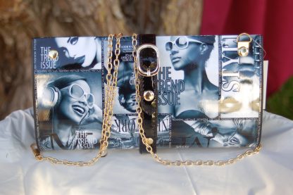 Magazine style hard case clutch